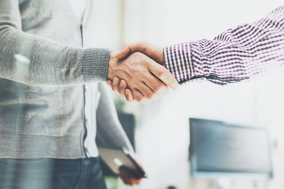 two men shaking hands